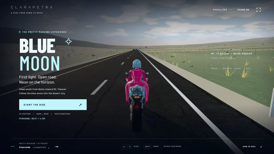 Blue Moon's live start screen: Clarapetra in a pink racing suit and cyan helmet sits on a motorcycle on an open Montana-inspired highway at dawn.
