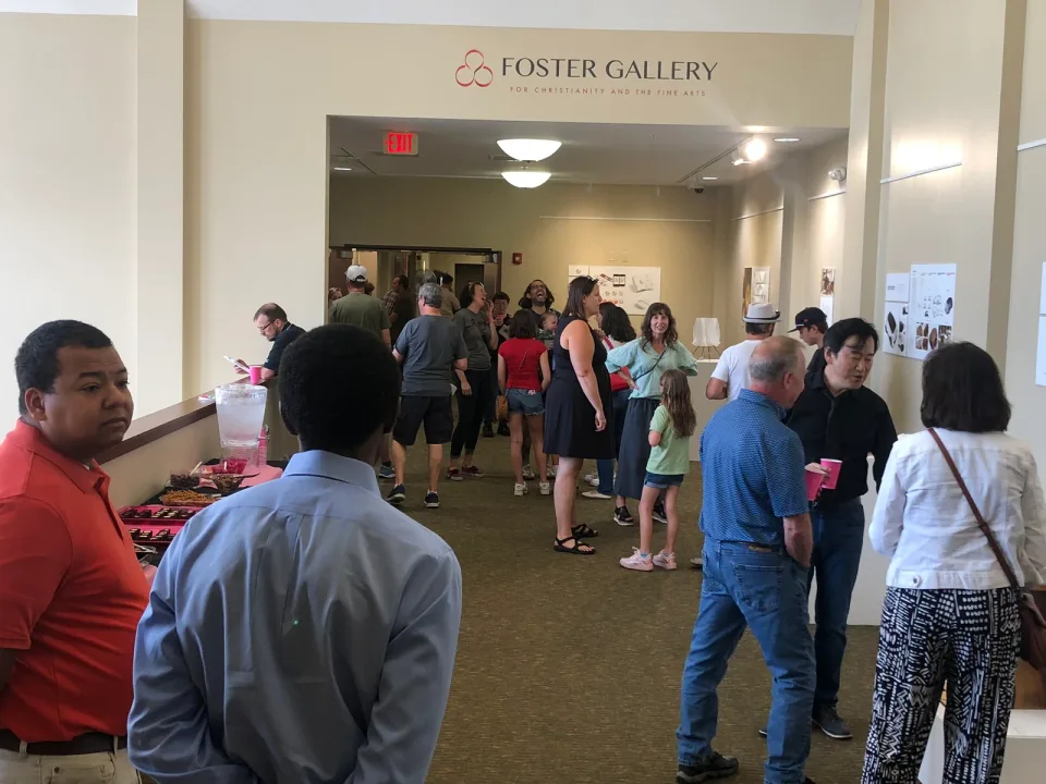 Visitors gathered beneath the Foster Gallery sign at the exhibition entrance.