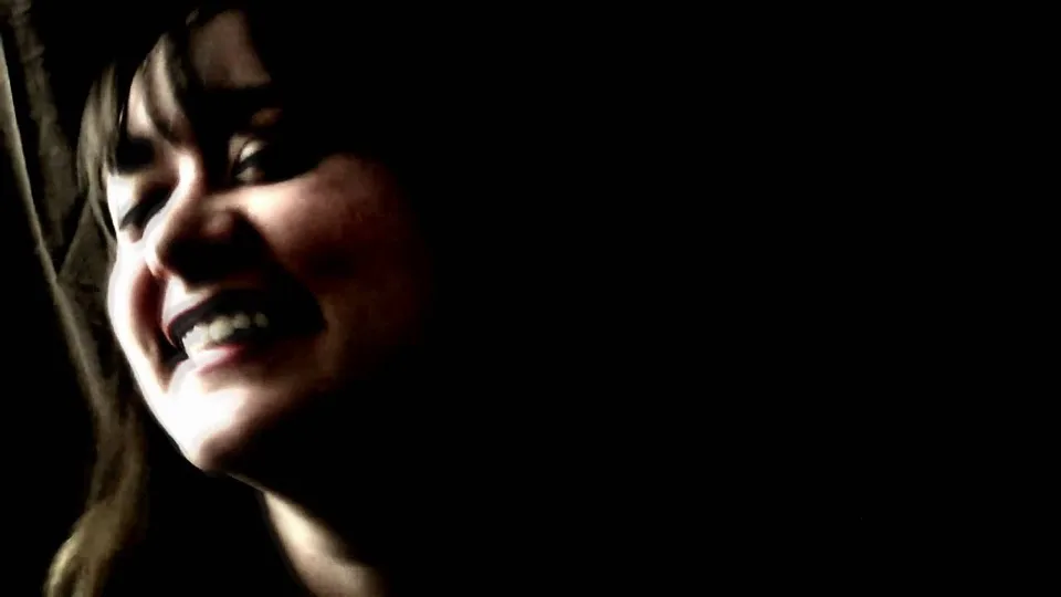 Low-key performance frame from The Aposematics' Harvest Moon music video.